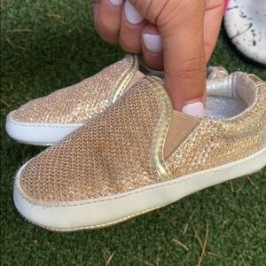 Stuart Weitzman gold shimmer slip ons